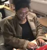Student sitting at a desk and working on her computer